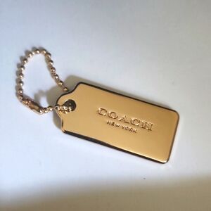 Coach gold tag bag charm keychain